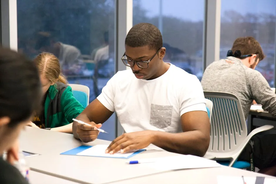 Student actively working through course exercises at desk